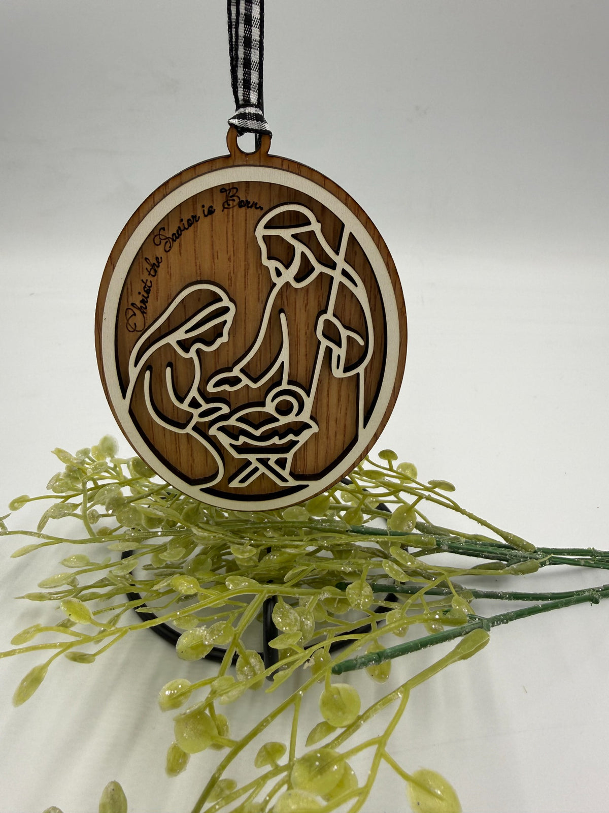 Actual wooden nativity ornament with gingham hanging ribbon