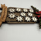 Side view showing layered construction of personalized wooden sled ornament